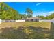 Expansive backyard with lush green grass, perfect for outdoor activities and relaxation at 12150 Se 88Th Ct, Belleview, FL 34420