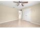Bedroom with tile flooring, ceiling fan and closet at 12150 Se 88Th Ct, Belleview, FL 34420