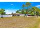 Single-story home with a spacious front yard, a long driveway, and a well-maintained lawn at 12150 Se 88Th Ct, Belleview, FL 34420