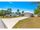 Charming single-Gathering home with a long driveway, attached two car garage and manicured landscaping at 12150 Se 88Th Ct, Belleview, FL 34420