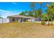 Charming single-story home with a well-maintained lawn and white picket fence at 12150 Se 88Th Ct, Belleview, FL 34420
