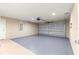 Clean and spacious garage with painted walls and a modern insulated garage door at 12150 Se 88Th Ct, Belleview, FL 34420