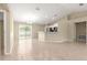 Bright living room with tile floors, eat in kitchen and sliding glass doors to back yard at 12150 Se 88Th Ct, Belleview, FL 34420