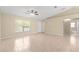 Living room with tile floors and neutral walls provides an open airy feeling at 12150 Se 88Th Ct, Belleview, FL 34420