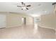 Open concept living room with neutral paint, tile flooring, recessed lighting, and a ceiling fan at 12150 Se 88Th Ct, Belleview, FL 34420