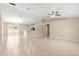 Open floor plan with tile floors, vaulted ceilings, view of kitchen and dining at 12150 Se 88Th Ct, Belleview, FL 34420