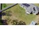 Birds eye of a home featuring a large yard, solar panels, and a gray roof at 12817 Sw 77Th Cir, Ocala, FL 34473