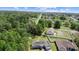 Aerial view of a house featuring solar panels and a well-maintained green lawn at 12817 Sw 77Th Cir, Ocala, FL 34473