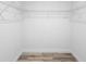 Empty walk-in closet featuring wood-look flooring and white wire shelving at 12817 Sw 77Th Cir, Ocala, FL 34473