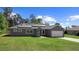 Charming single-story home with well-maintained lawn, attached garage and modern solar panels at 12817 Sw 77Th Cir, Ocala, FL 34473