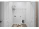 Bright laundry room featuring a wire shelf, utility hookups, and tile flooring at 12817 Sw 77Th Cir, Ocala, FL 34473