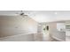 Inviting living room with high ceilings, wood floors and access to the kitchen area at 12817 Sw 77Th Cir, Ocala, FL 34473