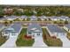 Aerial view of homes showcases community layout, landscaping, and cohesive design at 1282 Cottage Cir, Tavares, FL 32778