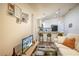 Inviting living room with seamless flow into modern kitchen and stylish bar stools at 1282 Cottage Cir, Tavares, FL 32778