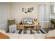 Inviting living room with stylish decor, plush seating, and a modern entertainment center with television at 1282 Cottage Cir, Tavares, FL 32778