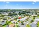 Aerial view of community highlights landscaping, surrounding homes, and neighborhood amenities for relaxation at 1306 Pedro Ct, The Villages, FL 32159