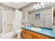 Bathroom featuring a shower-tub combination and a wide vanity with ample counter space at 1306 Pedro Ct, The Villages, FL 32159