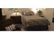 Well decorated bedroom with unique light fixtures and plush lounge seating at 1306 Pedro Ct, The Villages, FL 32159
