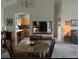 Open dining area with view into kitchen, hardwood floors, and lots of natural light at 1306 Pedro Ct, The Villages, FL 32159