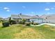 Inviting single-story home featuring a well-kept lawn and an attached two-car garage at 1306 Pedro Ct, The Villages, FL 32159