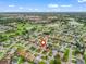 Community aerial view features numerous homes, golf course and a body of water at 1307 Galindo Pl, The Villages, FL 32159