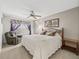 Bedroom boasts a ceiling fan, carpeted floors and large windows at 1307 Galindo Pl, The Villages, FL 32159