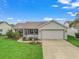 Charming single-story home with well-manicured lawn, attached two-car garage, and a screened in porch at 1307 Galindo Pl, The Villages, FL 32159