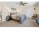The bedroom features calming decor, a ceiling fan, and two bedside lamps at 1307 Galindo Pl, The Villages, FL 32159