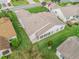 Aerial view of the home's rear exterior showing the well-manicured lawn and neutral siding at 1307 Galindo Pl, The Villages, FL 32159