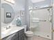 Contemporary bathroom with a large shower, and modern vanity at 13190 Se 93Rd Cir, Summerfield, FL 34491