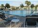 Relaxing poolside view with lounge chairs, providing a tranquil atmosphere for community enjoyment at 13190 Se 93Rd Cir, Summerfield, FL 34491