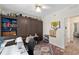 Home office featuring a built-in storage unit, a sewing machine, and an adjacent door at 13190 Se 93Rd Cir, Summerfield, FL 34491
