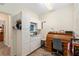 Well-lit home office with cabinets, desk and chair at 13190 Se 93Rd Cir, Summerfield, FL 34491