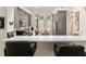 Contemporary kitchen featuring gray cabinetry, stainless steel appliances, and a dining area at 13190 Se 93Rd Cir, Summerfield, FL 34491