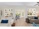 Open concept living room with decorative shelving at 13190 Se 93Rd Cir, Summerfield, FL 34491