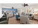Open-concept living area featuring hardwood floors and ample seating at 13190 Se 93Rd Cir, Summerfield, FL 34491