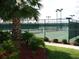 Well-maintained tennis courts with manicured landscaping in a desirable community at 13190 Se 93Rd Cir, Summerfield, FL 34491