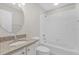 Bathroom featuring a sink vanity, toilet and shower-tub combo at 132 Palermo Pl, The Villages, FL 32159