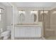 Bathroom with double vanity, granite countertops, glass enclosed shower and tile floors at 132 Palermo Pl, The Villages, FL 32159