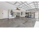 Spacious garage with shelving for storage and high ceilings at 132 Palermo Pl, The Villages, FL 32159