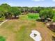 Picturesque golf course with manicured greens, mature trees, and players enjoying the game at 132 Palermo Pl, The Villages, FL 32159