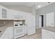 Kitchen with white appliances, lots of cabinet space, and granite countertops at 132 Palermo Pl, The Villages, FL 32159