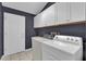 Laundry room with washer, dryer, utility sink and cabinetry at 132 Palermo Pl, The Villages, FL 32159