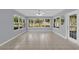 Bright living room featuring tile floors, many windows for natural light and backyard view at 132 Palermo Pl, The Villages, FL 32159