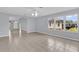 Bright living room featuring tile floors, ceiling fan and windows for natural light at 132 Palermo Pl, The Villages, FL 32159