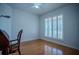 Office or bedroom with hardwood floors, shutters and ceiling fan at 15141 Farm Rd, Groveland, FL 34736