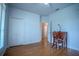 Bright bedroom has hardwood floors, closet and a writing desk at 15141 Farm Rd, Groveland, FL 34736