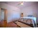 Bedroom with a closet, hardwood floors and doorway to another room at 15141 Farm Rd, Groveland, FL 34736