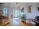 Inviting foyer featuring hardwood floors and an ornate glass front door at 15141 Farm Rd, Groveland, FL 34736