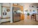 Open kitchen features stainless steel appliances and tile flooring at 15141 Farm Rd, Groveland, FL 34736